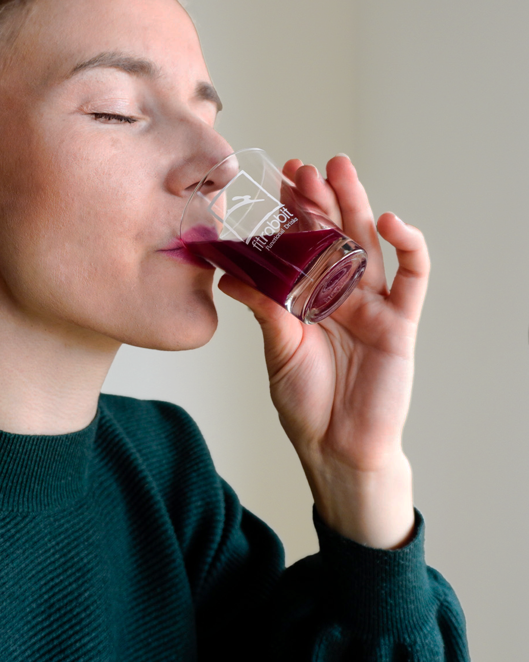 woman drinking beet root juice